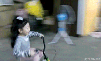 little-girl-parks-bike